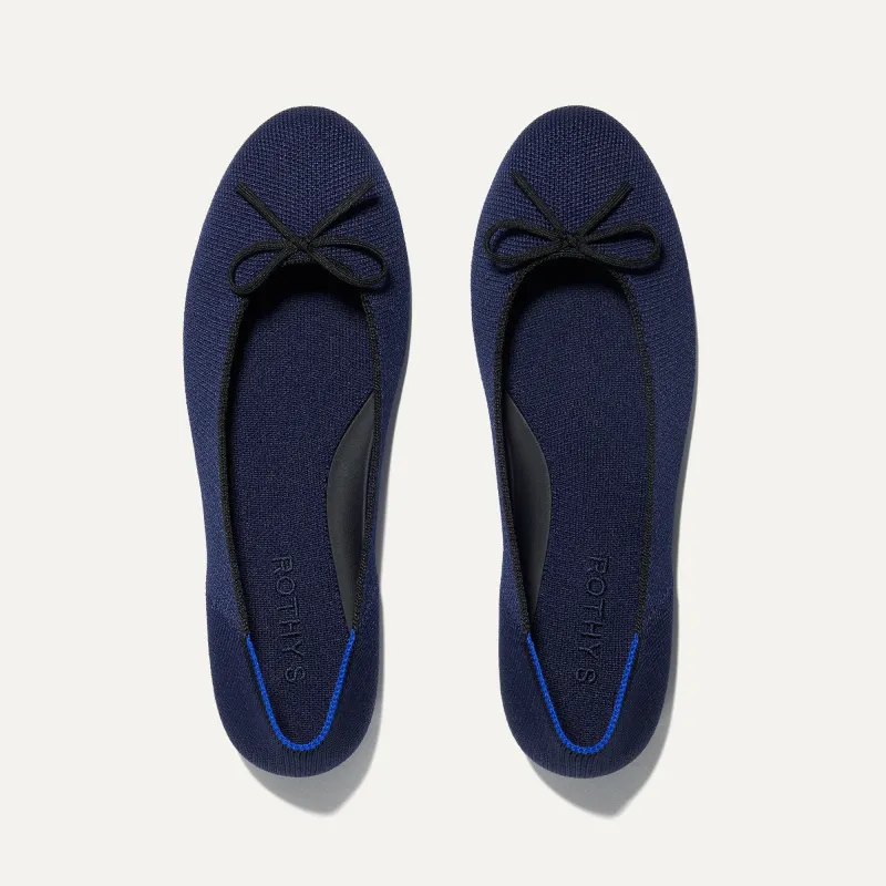 The Ballet Flat - Dark Navy sold by Rothy's