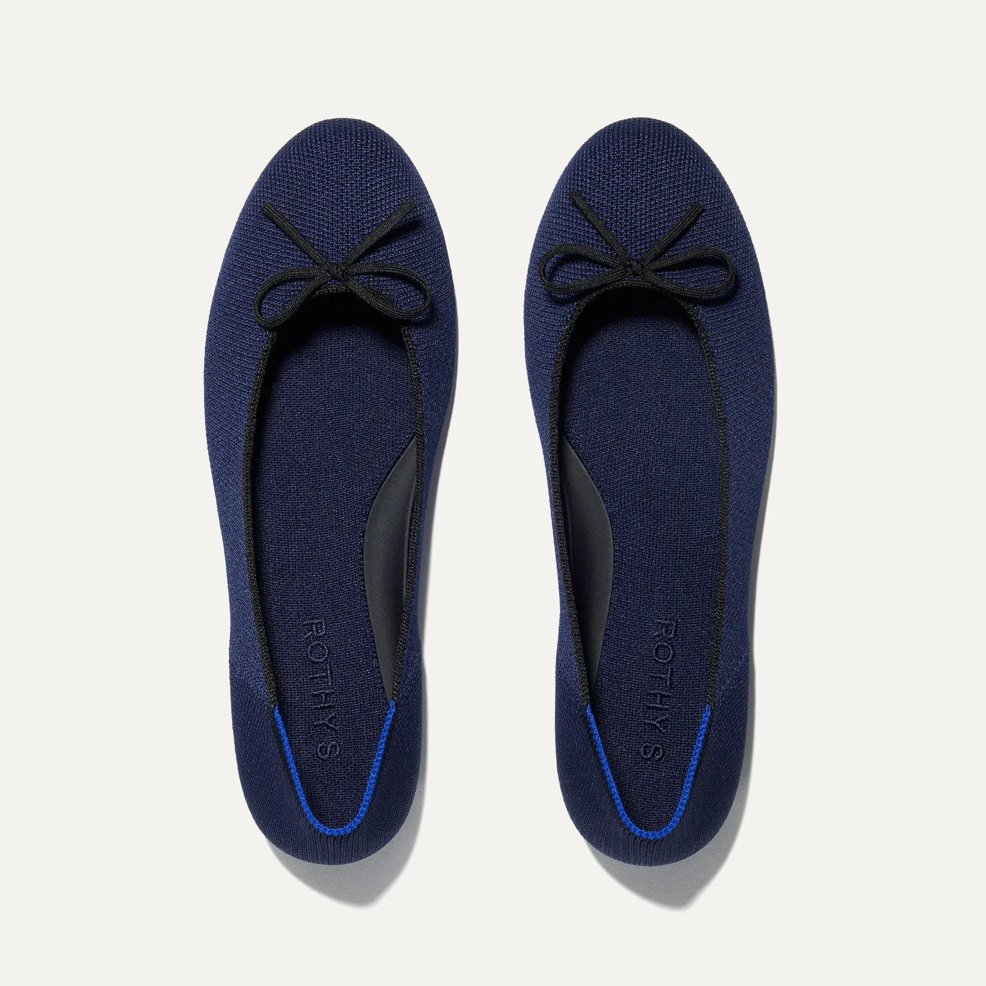 The Ballet Flat - Dark Navy sold by Rothy's