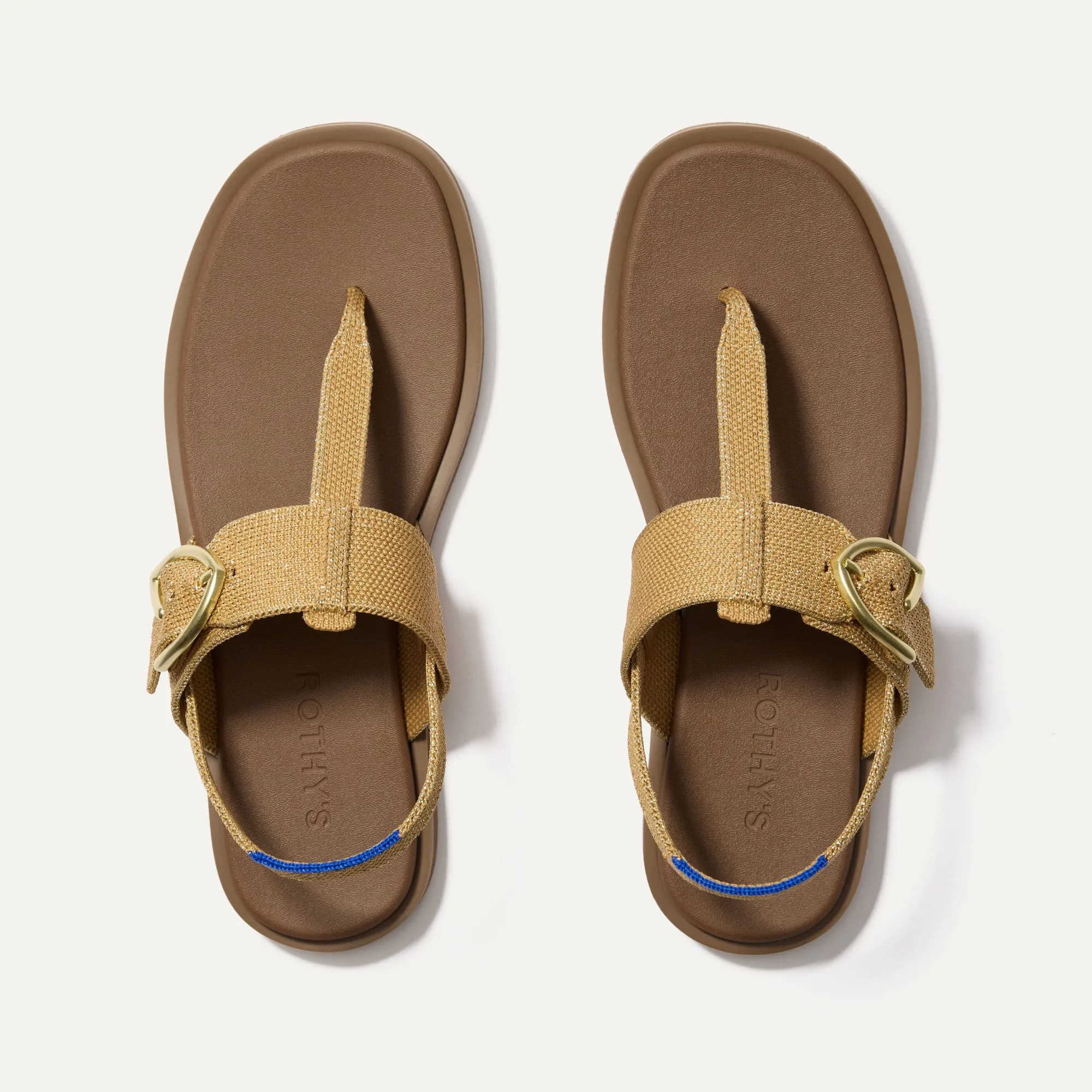 The T–Strap Sandal - Golden Sun sold by Rothy's