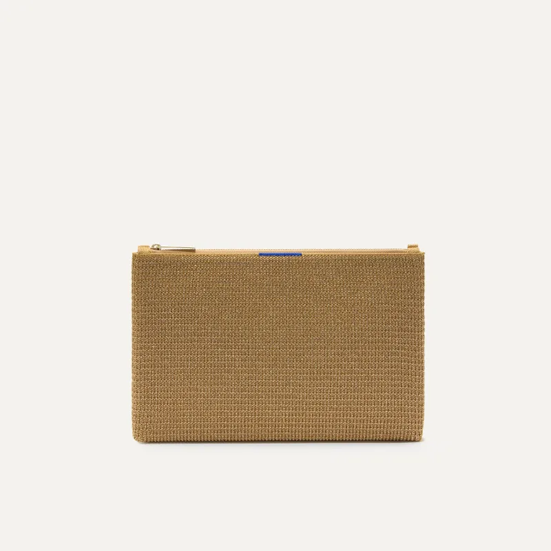 The Convertible Clutch - Glitzy Gold sold by Rothy's