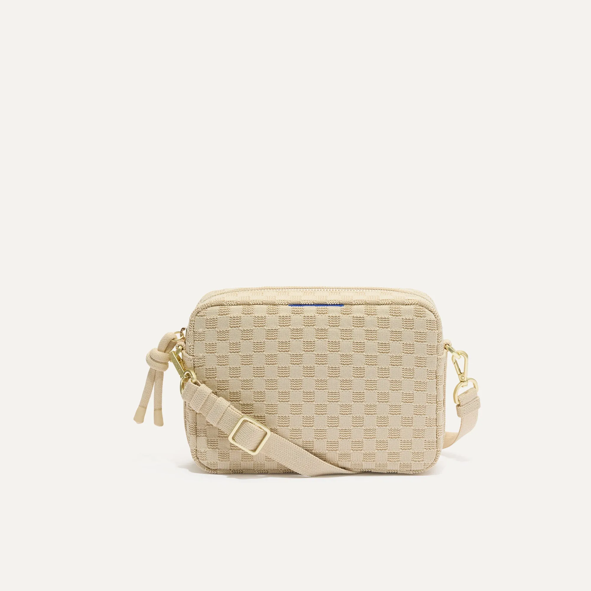 The Crossbody Camera Bag - Sesame sold by Rothy's