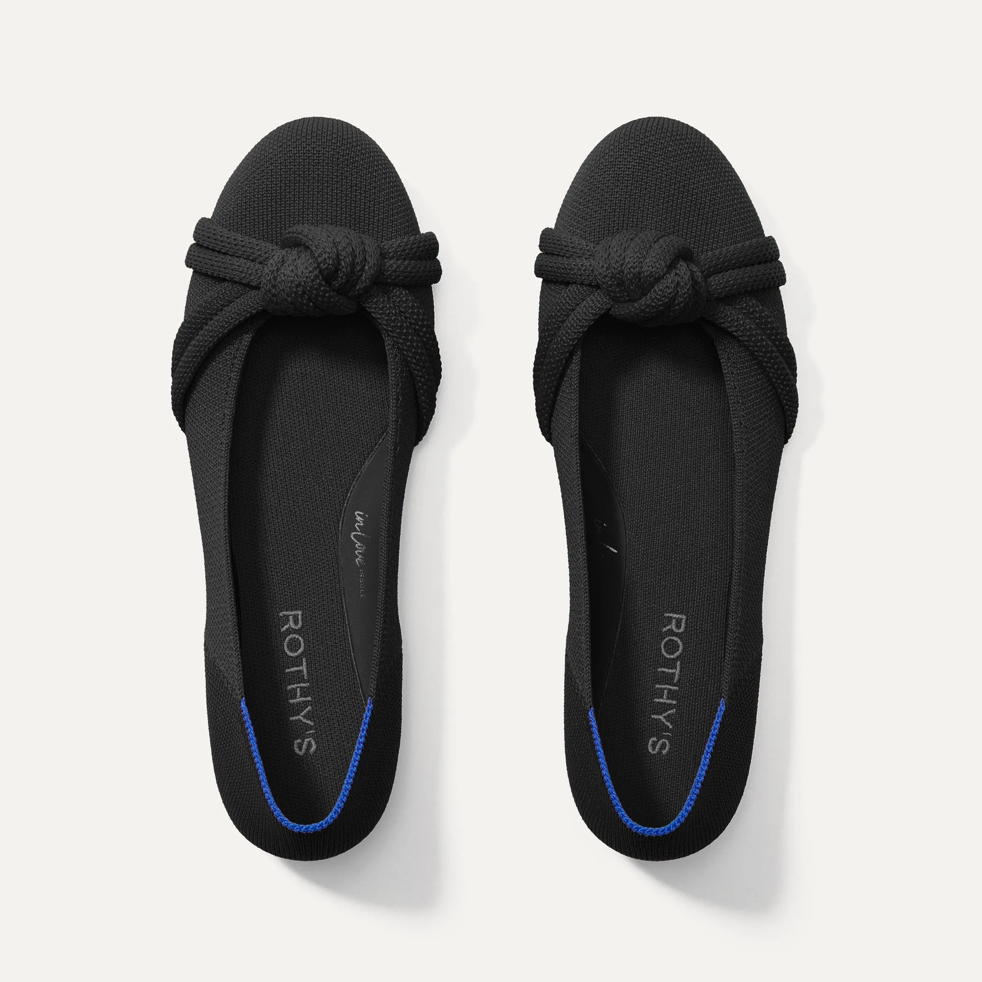 The Knot Ballet Flat - Black sold by Rothy's
