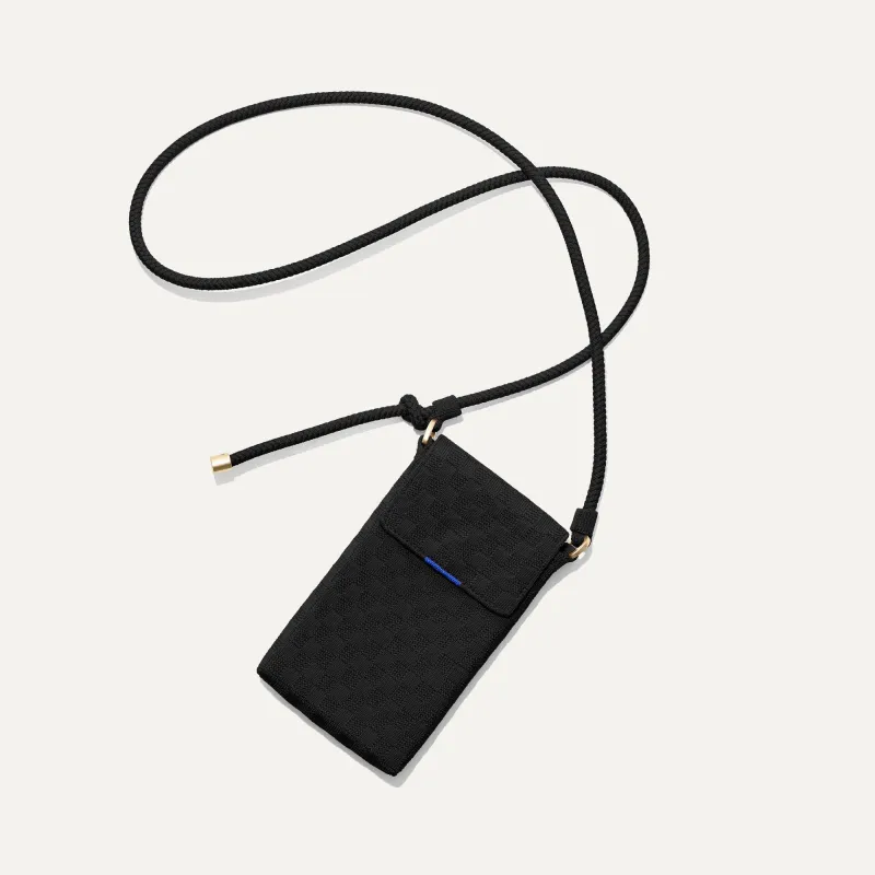 The Phone Crossbody - Black Sand sold by Rothy's