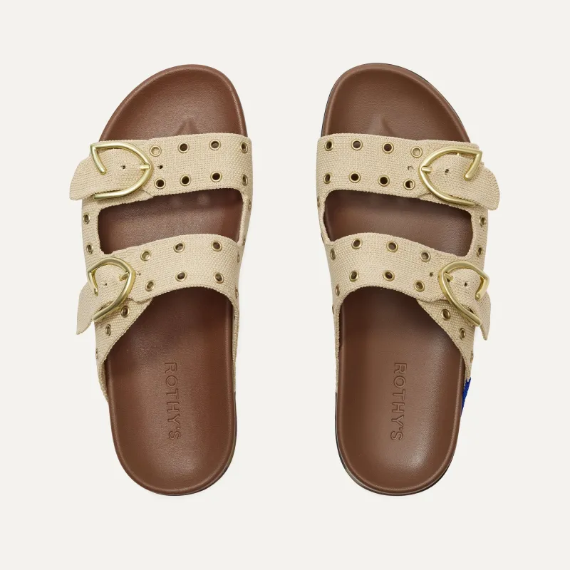 The Buckle Slide - Eyelet Wheat sold by Rothy's