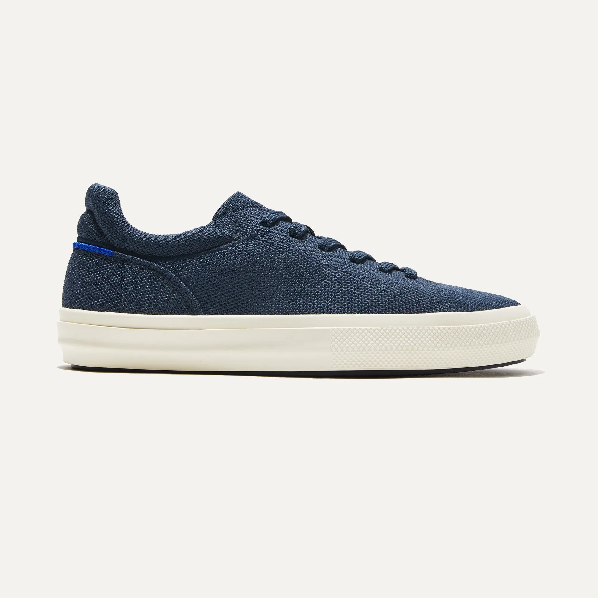 The Women's RS02 Sneaker - Navy sold by Rothy's