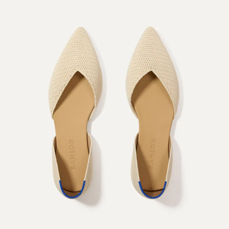 The D'Orsay Point - Conch Raffia-Knit sold by Rothy's