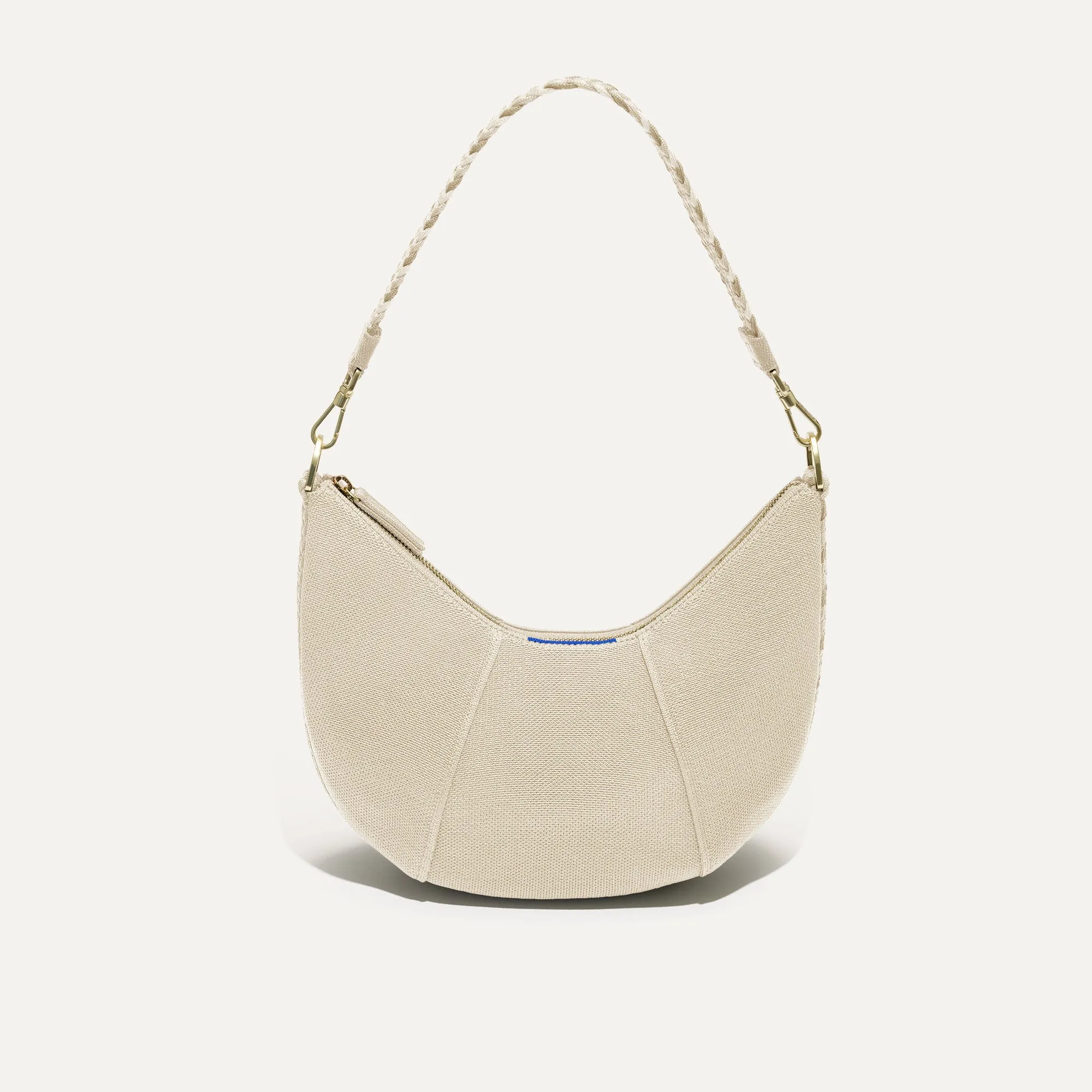The Crescent Bag - Cream Twist sold by Rothy's