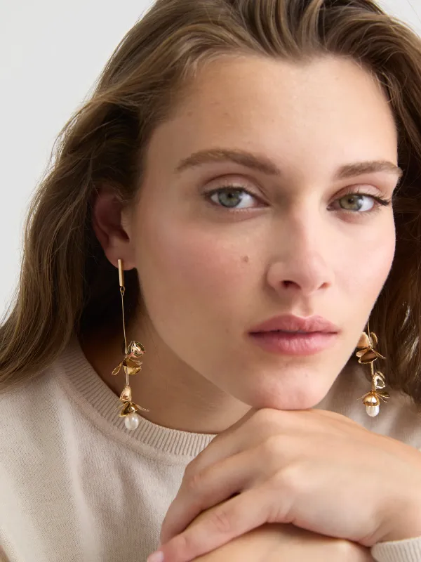 Golden Earrings with Flower Pendants with Pearls sold by RW&CO.