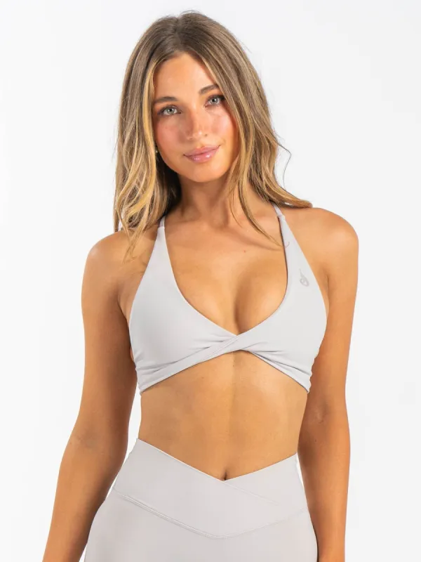NKD Twist Sports Bra - Sugar Dust sold by Ryderwear