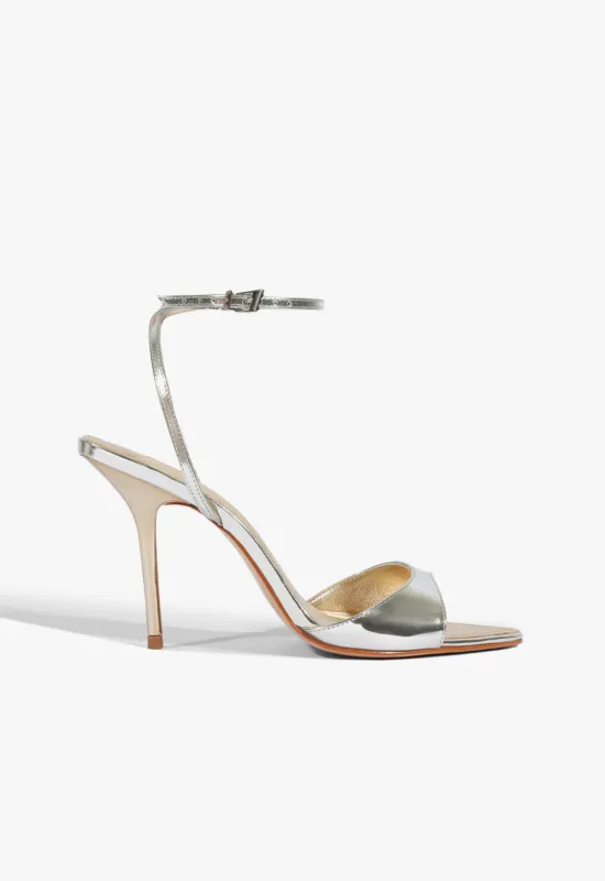 Elodie Buckle Metallic Sandal sold by SCHUTZ