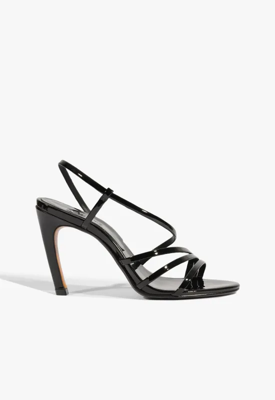 Annie Curve Patent Sandal sold by SCHUTZ