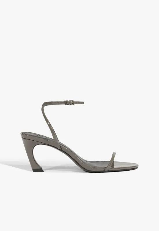 Siena Curve Mid Patent Sandal sold by SCHUTZ