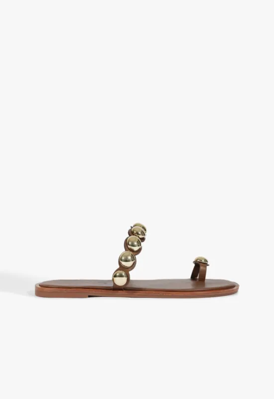 Romy Brown Leather Flat Sandal sold by SCHUTZ