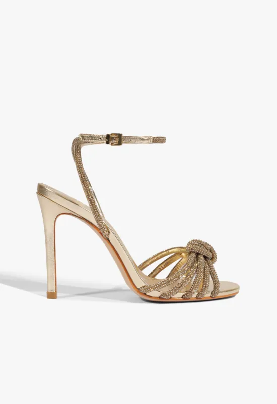 Pearline Buckle Metallic Sandal sold by SCHUTZ