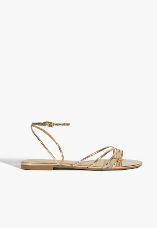 Inez Gold Leather Flat Sandal sold by SCHUTZ