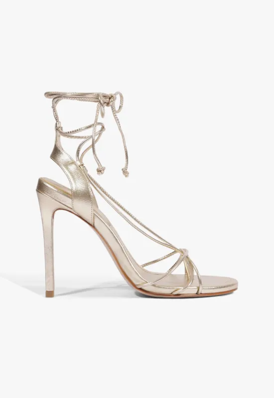 Demetria Metallic Leather Sandal sold by SCHUTZ