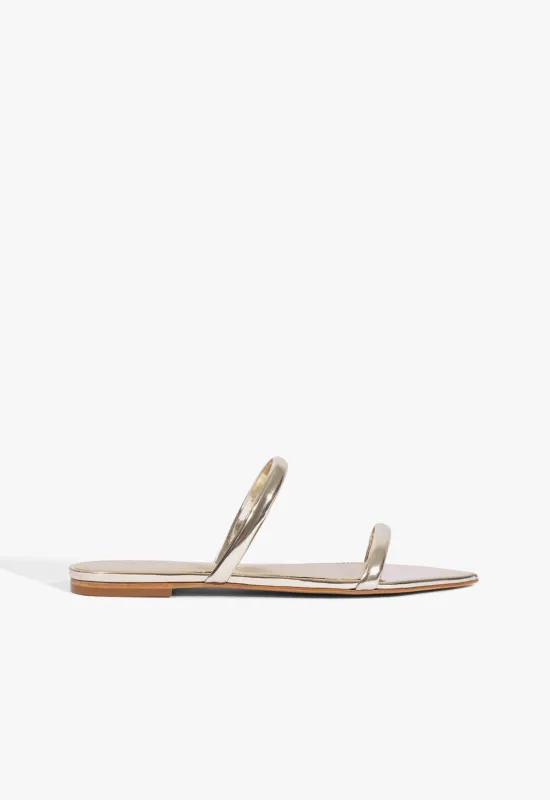 Nylle Metallic Flat Sandal sold by SCHUTZ