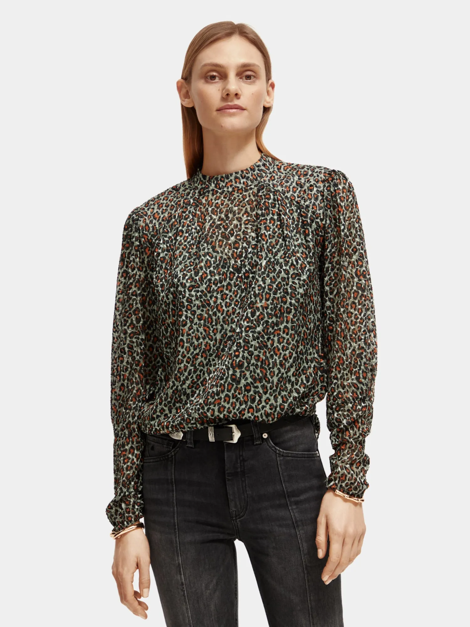Mock neck open back blouse sold by Scotch & Soda