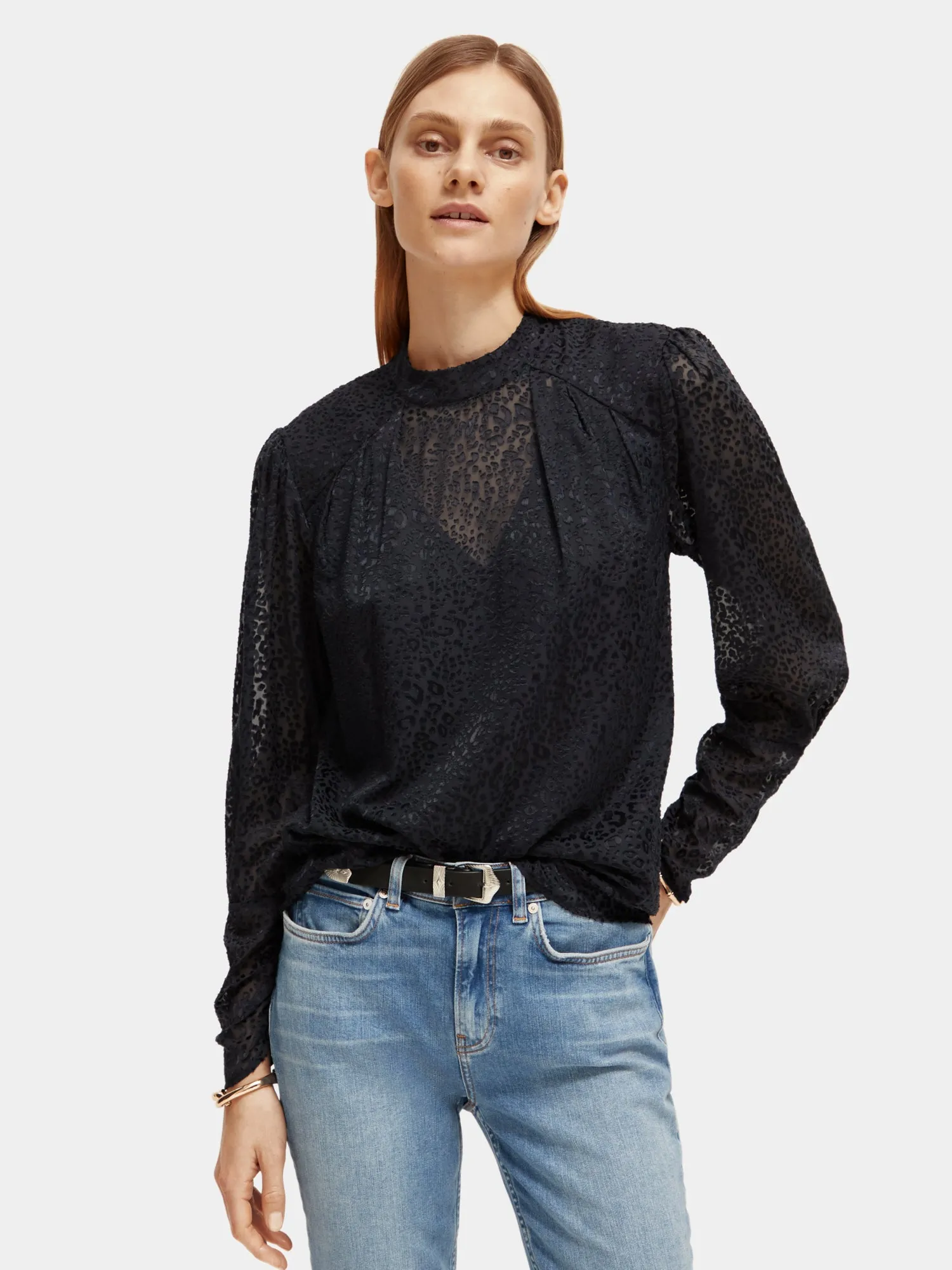 Mock neck open back blouse sold by Scotch & Soda