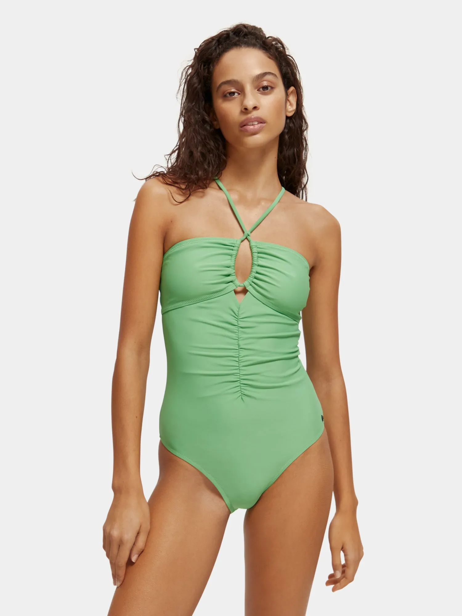 Ruched front halter swimsuit sold by Scotch & Soda
