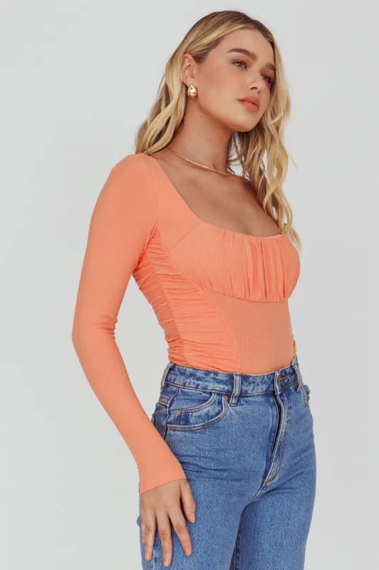 Bobbi Long Sleeve Ruched Side Ribbed Bodysuit Orange sold by Selfie Leslie