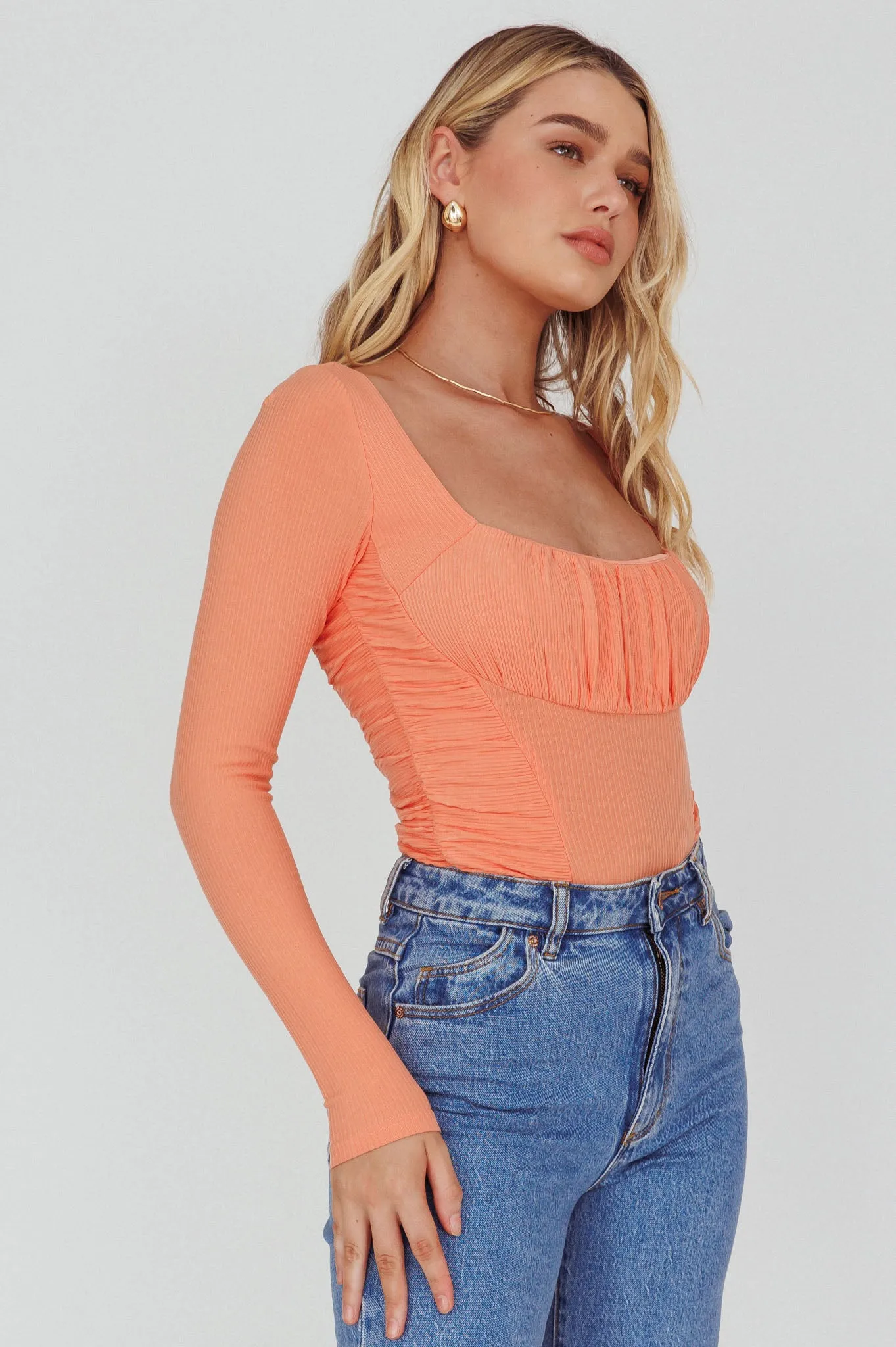 Bobbi Long Sleeve Ruched Side Ribbed Bodysuit Orange sold by Selfie Leslie