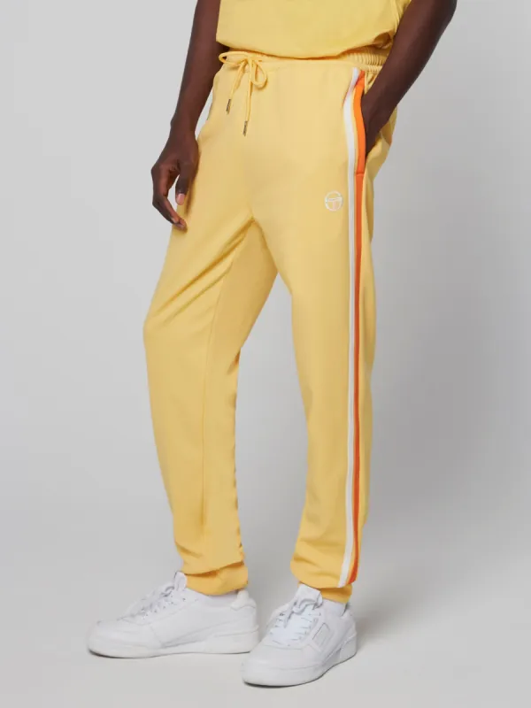 Damarindo Track Pant- Flax/ Dragon Fire sold by Sergio Tacchini