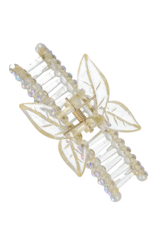 Pinza mariposa transparente brillos sold by Shasa