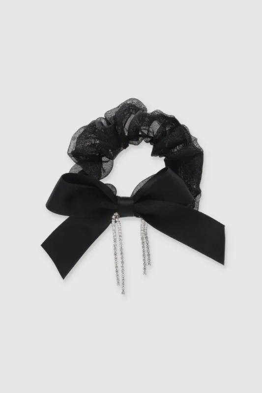 Scrunchie moño brillos sold by Shasa