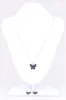 Set Aretes Collar Mariposa Color sold by Shasa