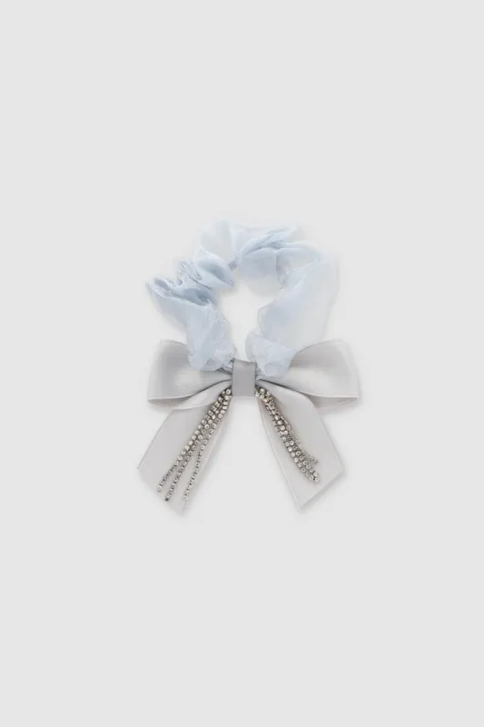 Scrunchie moño brillos sold by Shasa