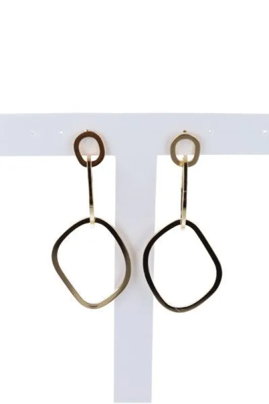 Aretes largos circulo asimétrico sold by Shasa