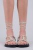 Sandalias planas lace up nudos sold by Shasa