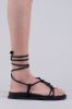 Sandalias planas lace up nudos sold by Shasa