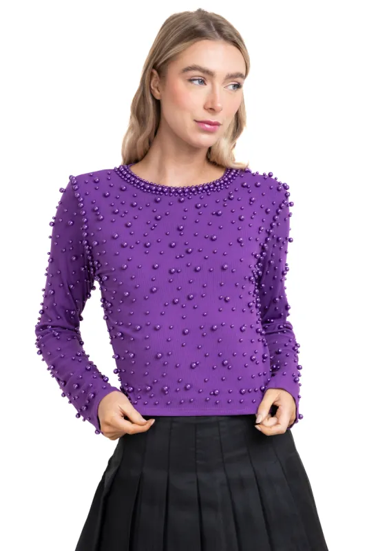 Sueter de perlas y brillos sold by Shasa