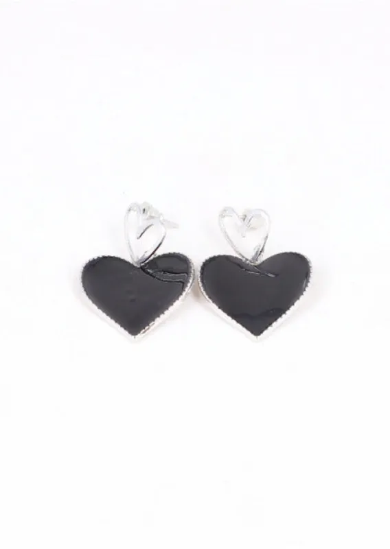 Aretes largos doble corazón sold by Shasa