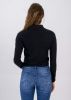 Top crop cuello polo manga larga sold by Shasa