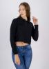 Top crop cuello polo manga larga sold by Shasa