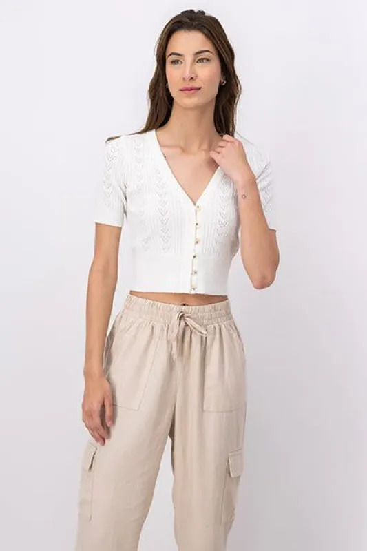 Top tejido botones manga corta sold by Shasa