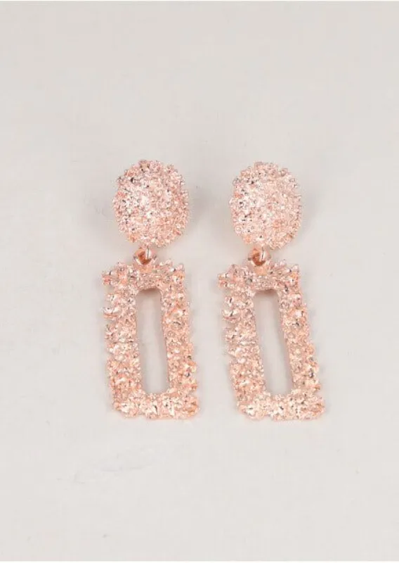 Aretes rectángulo brillo sold by Shasa