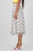 Falda midi de mesh con moños en flock sold by Shasa