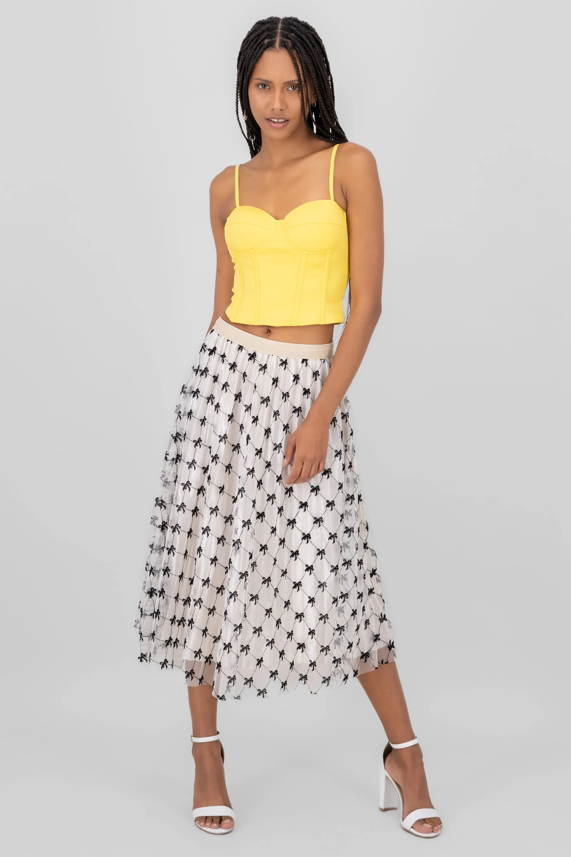 Falda midi de mesh con moños en flock sold by Shasa