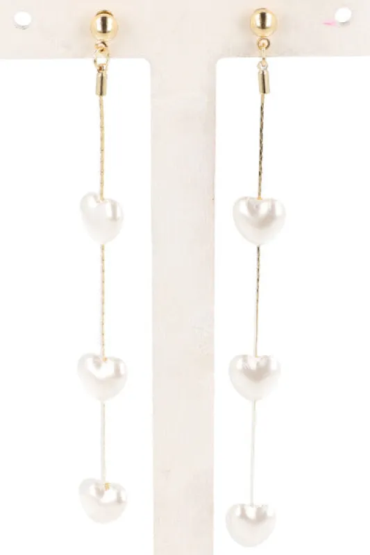 Aretes Corazones Colgantes sold by Shasa