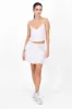 Falda short con olanes liso sold by Shasa