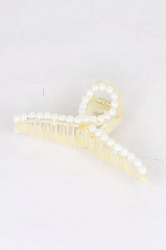 Pinza larga perlas sold by Shasa