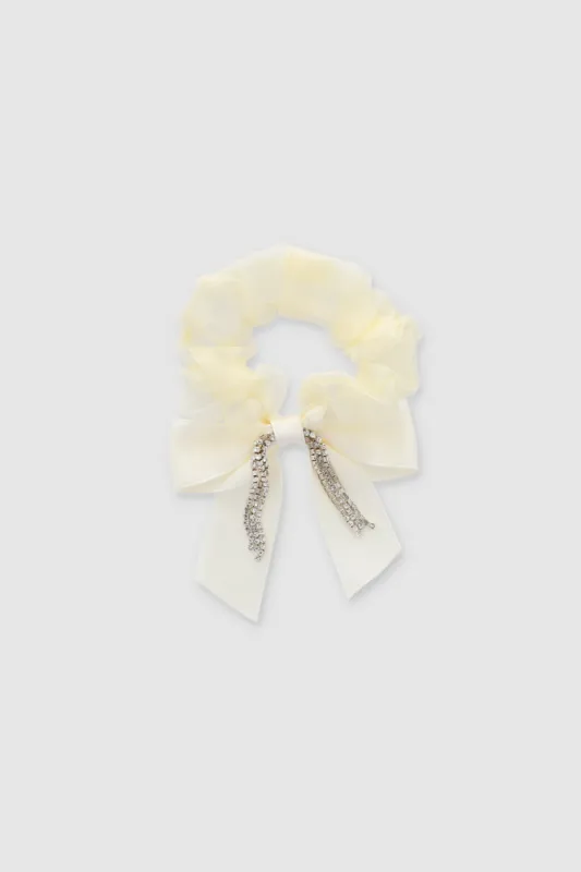 Scrunchie moño brillos sold by Shasa