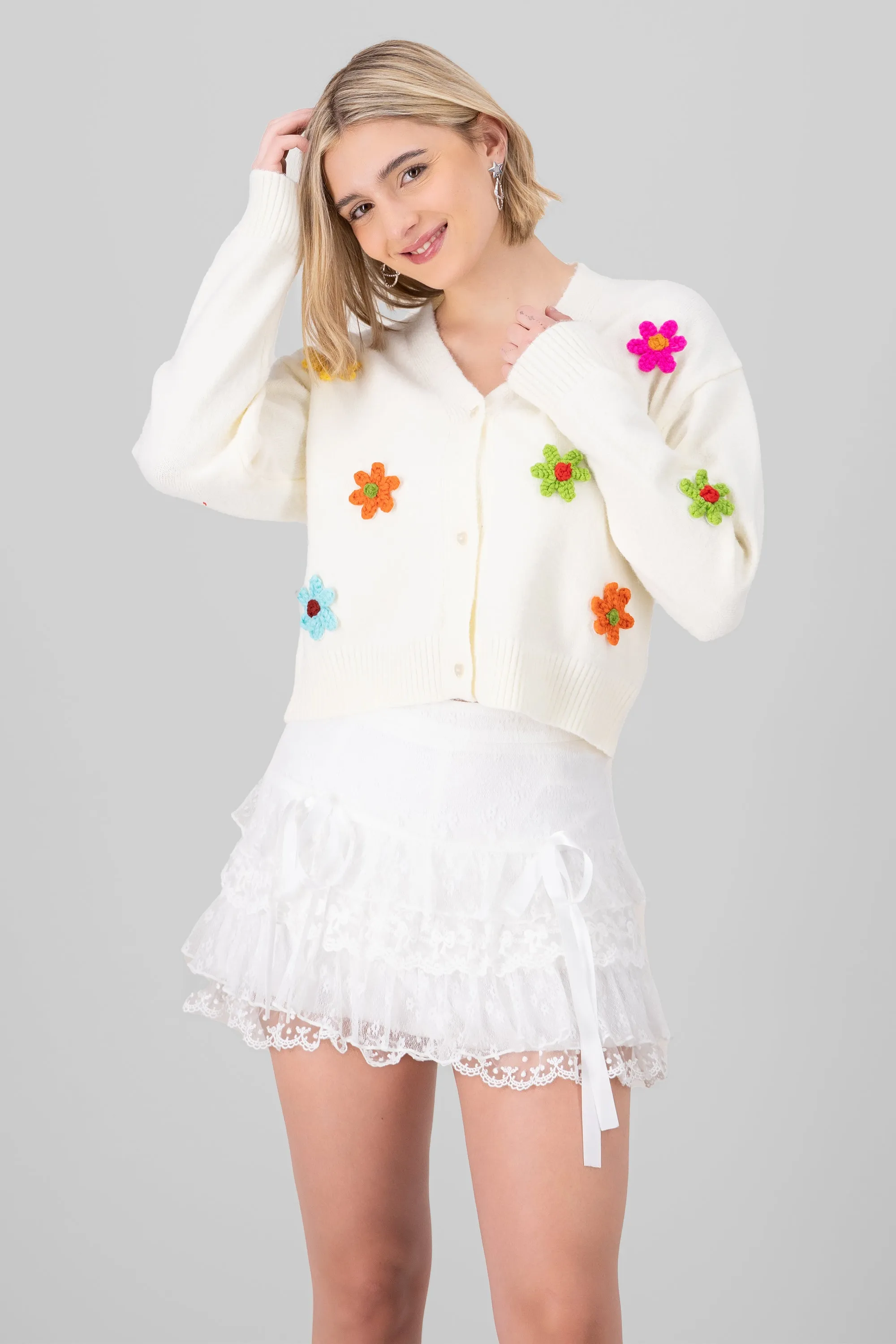 Cardigan tejido flores sold by Shasa