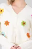 Cardigan tejido flores sold by Shasa