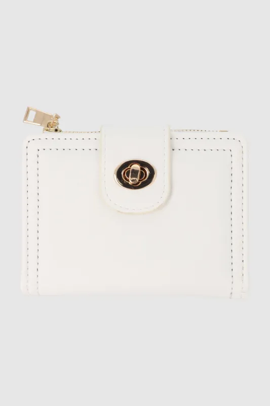 Cartera pequeña broche giratorio sold by Shasa