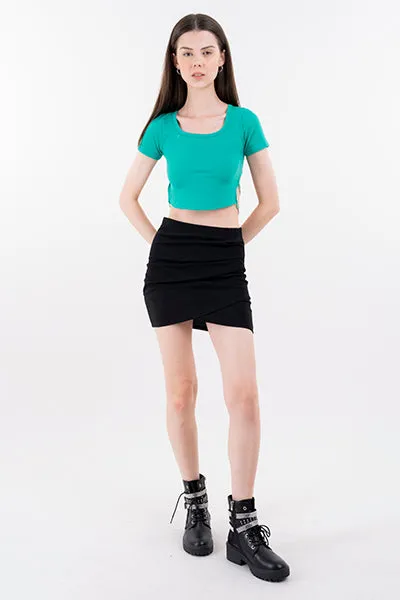 Falda mini cruzada lisa sold by Shasa